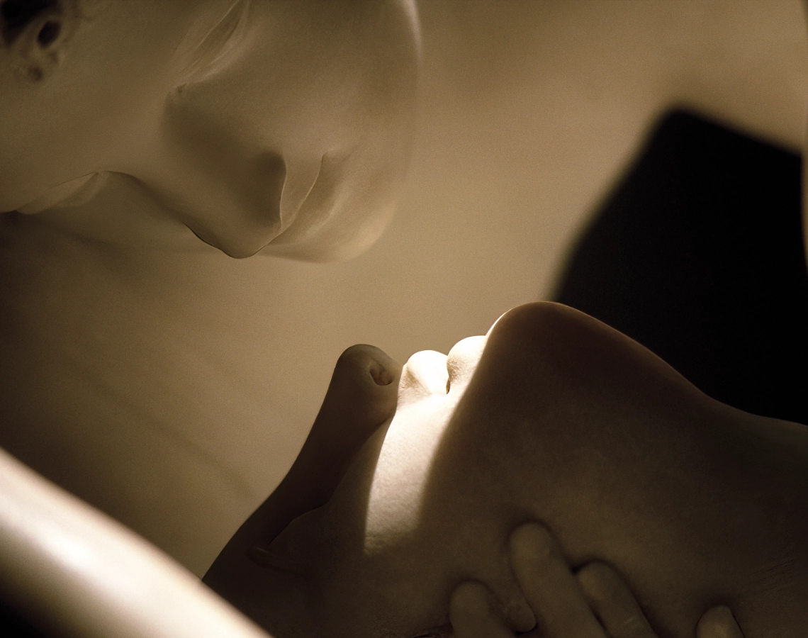 A closeup of Antonio Canova's 1793 marble sculpture, Eros and Psyche, which depicts Eros reviving Psyche with a kiss.